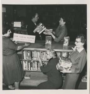 Staff preparing a book display